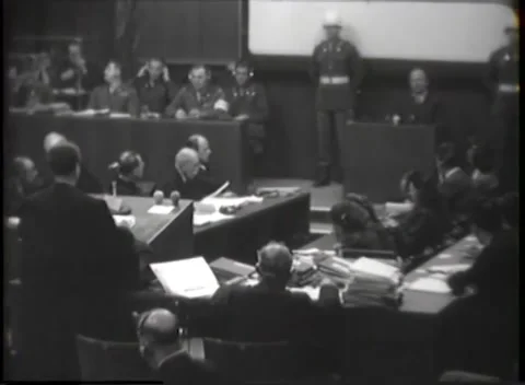 NUREMBERG, GERMANY - 1946: War Crimes Trials — Court listening on headphones Stock Footage 342818680