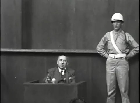 NUREMBERG, GERMANY - 1946: War Crimes Trials — Witness box under MP guard Stock Footage 342818930