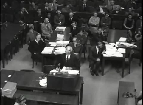 NUREMBERG, GERMANY - 1946: War Crimes Trials — Head bowed at the low lectern Stock Footage 342818975