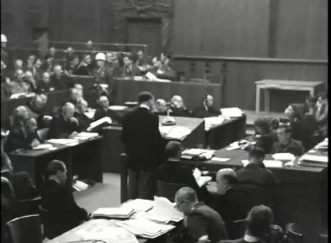 NUREMBERG, GERMANY - 1946: War Crimes Trials — High wide over the dock Stock Footage 342920663