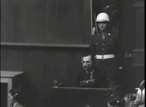 NUREMBERG, GERMANY - 1946: War Crimes Trials — Armed guard at the witness box Stock Footage 342920697