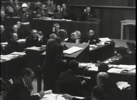 NUREMBERG, GERMANY - 1946: War Crimes Trials — From behind the counsel benches Видео 342920729