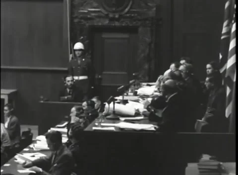 NUREMBERG, GERMANY - 1946: War Crimes Trials — Microphones down the long table Stock Footage 342920745