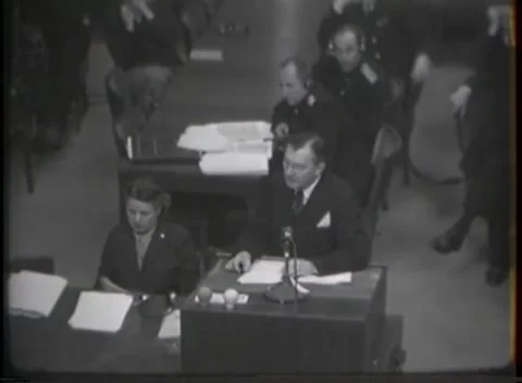 NUREMBERG, GERMANY - 1946: War Crimes Trials — Desk microphone from above Stock Footage 342920897