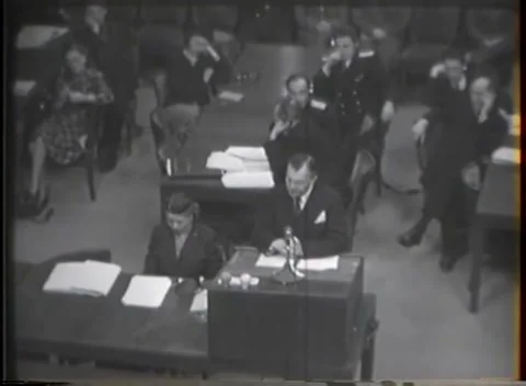 NUREMBERG, GERMANY - 1946: War Crimes Trials — Headphones held to one ear Stock Footage 342920918
