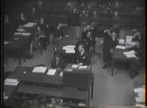 NUREMBERG, GERMANY - 1946: War Crimes Trials — Long shot down the courtroom Stock Footage 342920940