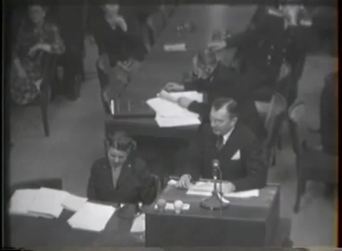 NUREMBERG, GERMANY - 1946: War Crimes Trials — Close over the desk, papers out Stock Footage 342920962