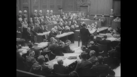 NUREMBERG, GERMANY - 1946: wide view of the crowded trial chamber Stock Footage 339168633