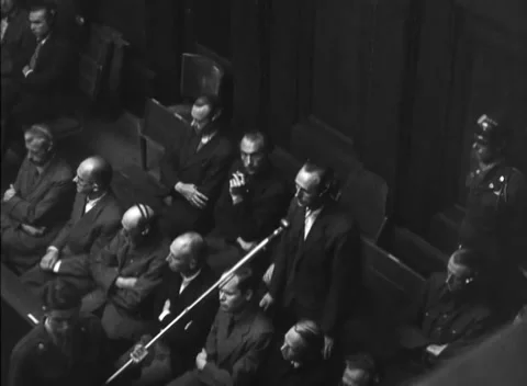 NUREMBERG, GERMANY - 1947: Arraignment — Headphoned rows under angled boom 库存影片 343320787
