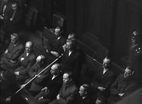 NUREMBERG, GERMANY - 1947: Arraignment — Raised hands beside dock microphone Vídeos de archivo 343320786