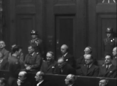 NUREMBERG, GERMANY - 1947: Empty rail - Men sit closely between dock guards Stock Footage 344490694