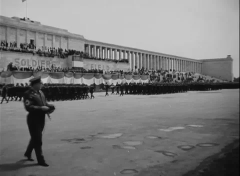 NUREMBERG, GERMANY - 1950: Field parade - Band passes ranks before grandstand Stock Footage 344489068
