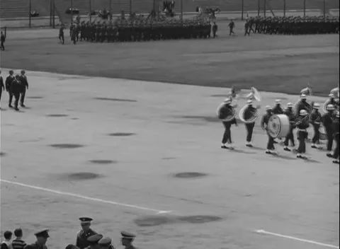 NUREMBERG, GERMANY - 1950: Parade apron - Band wheels past officers and crowds Видео 344489087
