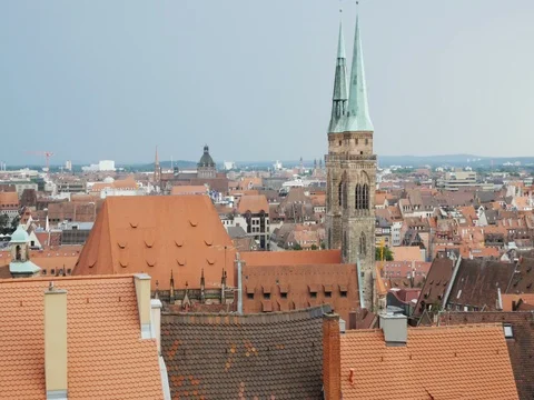 NUREMBERG, GERMANY August 14, 2017: Church and old town with cloudy sky by day t Stock Footage 79984322