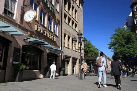 NUREMBERG, GERMANY - MAY 7, 2018: People visit Hefnersplatz (Hefner Square) s Stock Photos