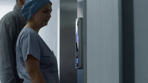 Nurse and elderly patient wait elevator Stock Footage 249790371