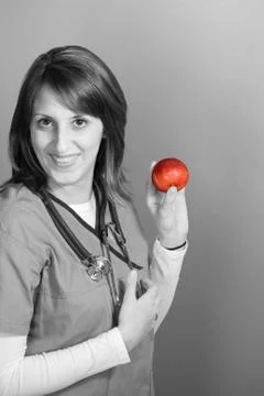 Nurse With An Apple Stock Photos