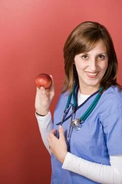 Nurse With An Apple Stock Photos