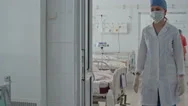 Nurse Caring For Elderly Patient In Icu Stock Footage