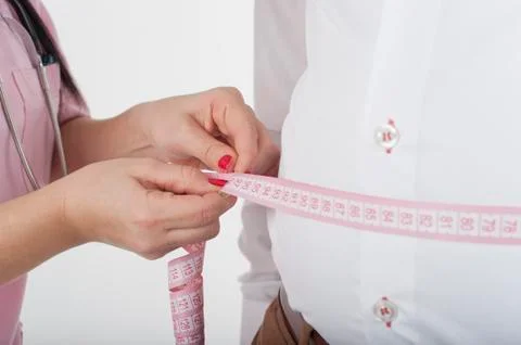 Nurse check weight for obesity Stock-Fotos