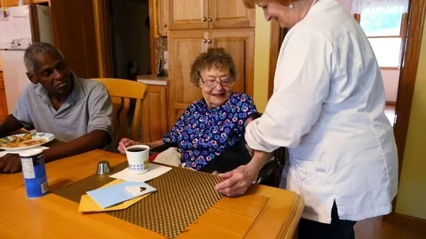 A nurse checking blood pressure on an elderly woman Stock Footage 77374688