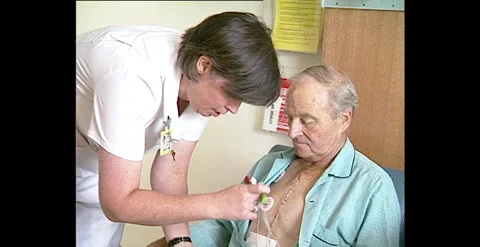 Nurse Checking Elderly Patient’s Heart in Hospital Ward, Australia (1994) Stock-Footage 310930480