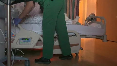 Nurse checking on a patient Stock Footage 73435811