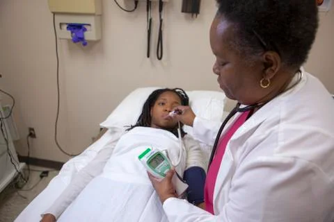 Nurse checking patient temperature Stock Photos