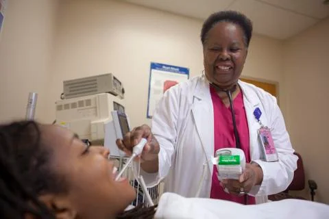 Nurse checking patient temperature Stock Photos