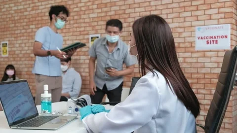 Nurse checks coronavirus vaccination queue. Stock Footage 156942803