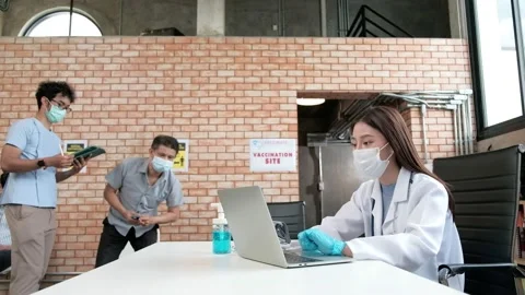 Nurse checks coronavirus vaccination queue. Stock Footage 157670947