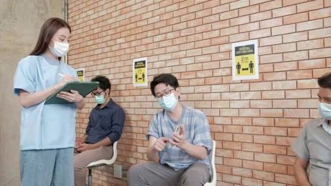 Nurse checks coronavirus vaccination queue. Stock Footage 159459328