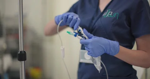 Nurse in closeup preparing an IV fluid b... | Stock Video | Pond5