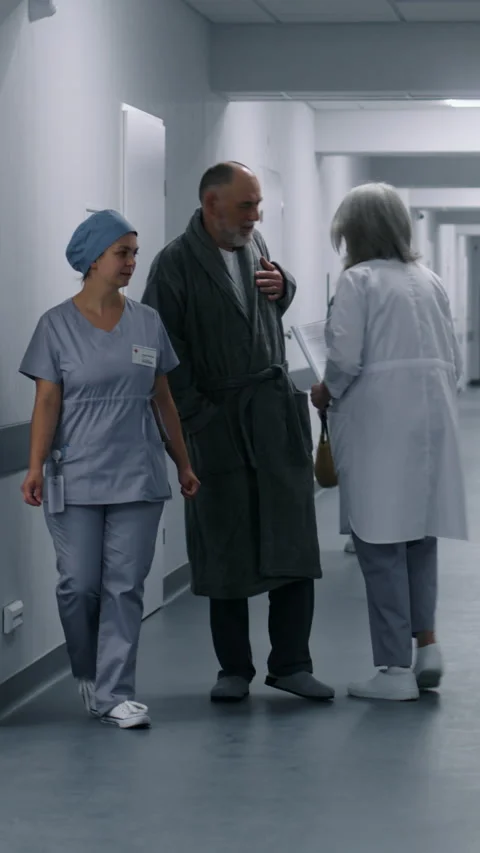 Nurse comes into elevator with aged patient Stock Footage 274910243