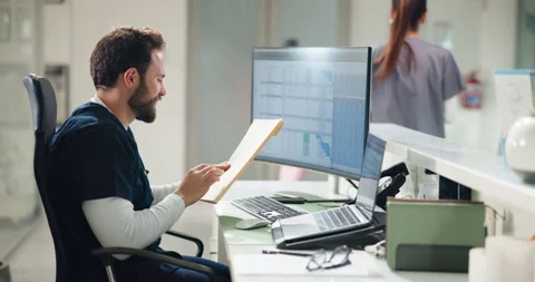 Nurse, computer and screen with folder in hospital for patient database, digital Stock Footage 311082259
