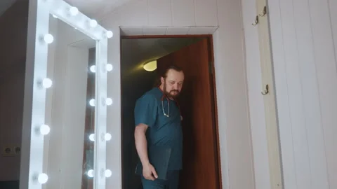 Nurse details appearance while preparing for hospital interaction. Calm medical Video stock 342337086