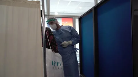 Nurse does a covid-19 test at the Athens airport Stock Footage 142874264