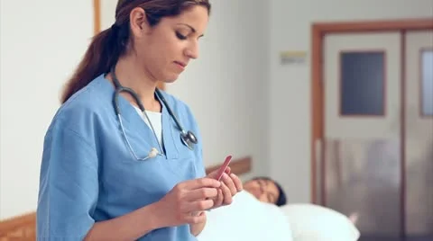 Nurse doing her nails Stock Footage
