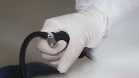 Nurse doing pressure test on patient with corona virus Stock Footage 153345071