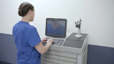 Nurse entering pulling and checking vial of medication for hospital med cart Stock Footage 109506707