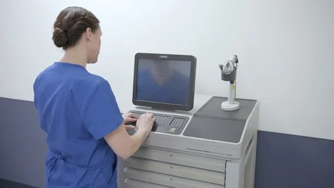 Nurse entering pulling and checking pill medication for hospital med cart Stock Footage 109506721