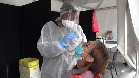 Nurse with face mask shield tests woman, Covid-19 coronavirus Paris France Stock-Footage 143323335