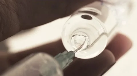 Nurse Filling Injection Syringe From Vial, Slow Motion Stock Footage