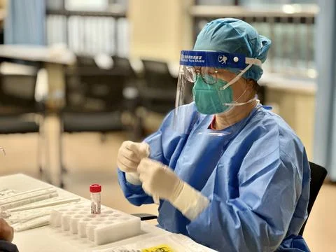 Nurse Getting Ready for PCR Test on a passenger Stock Photos