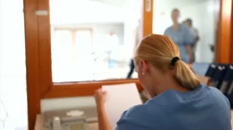 Nurse giving a folder to a nurse Stock Footage 11440157