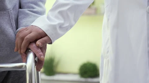 Nurse hand of hope to the elderly Stock Footage