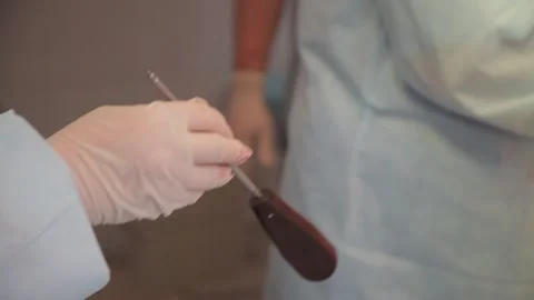 Nurse hands over the surgical instruments to the surgeon during the operation Stock Footage 135309988