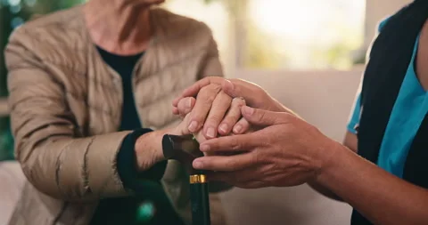 Nurse, holding hands and cane with old woman on sofa in house for empathy, Stock Footage 341388674