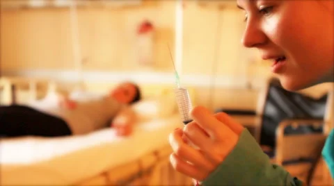 Nurse holding a needle 2 Video stock 3679260