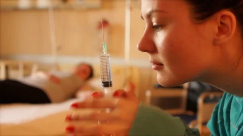 Nurse holding a needle Stock Footage 3679224